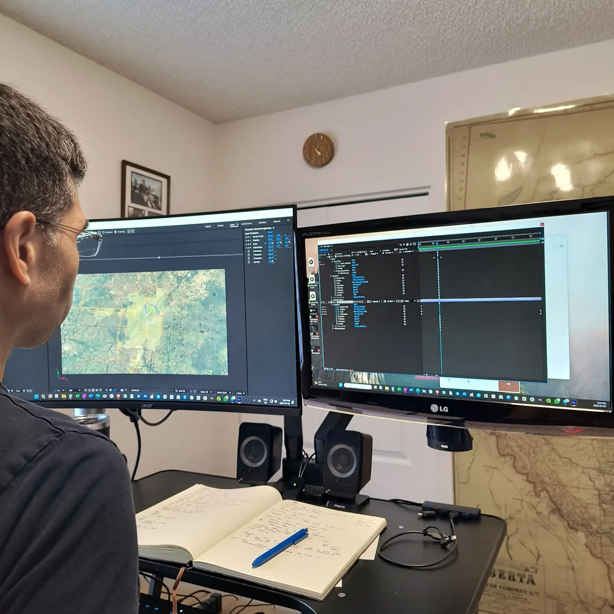 Clayton Smith working with GIS and mapping tools at a workstation
